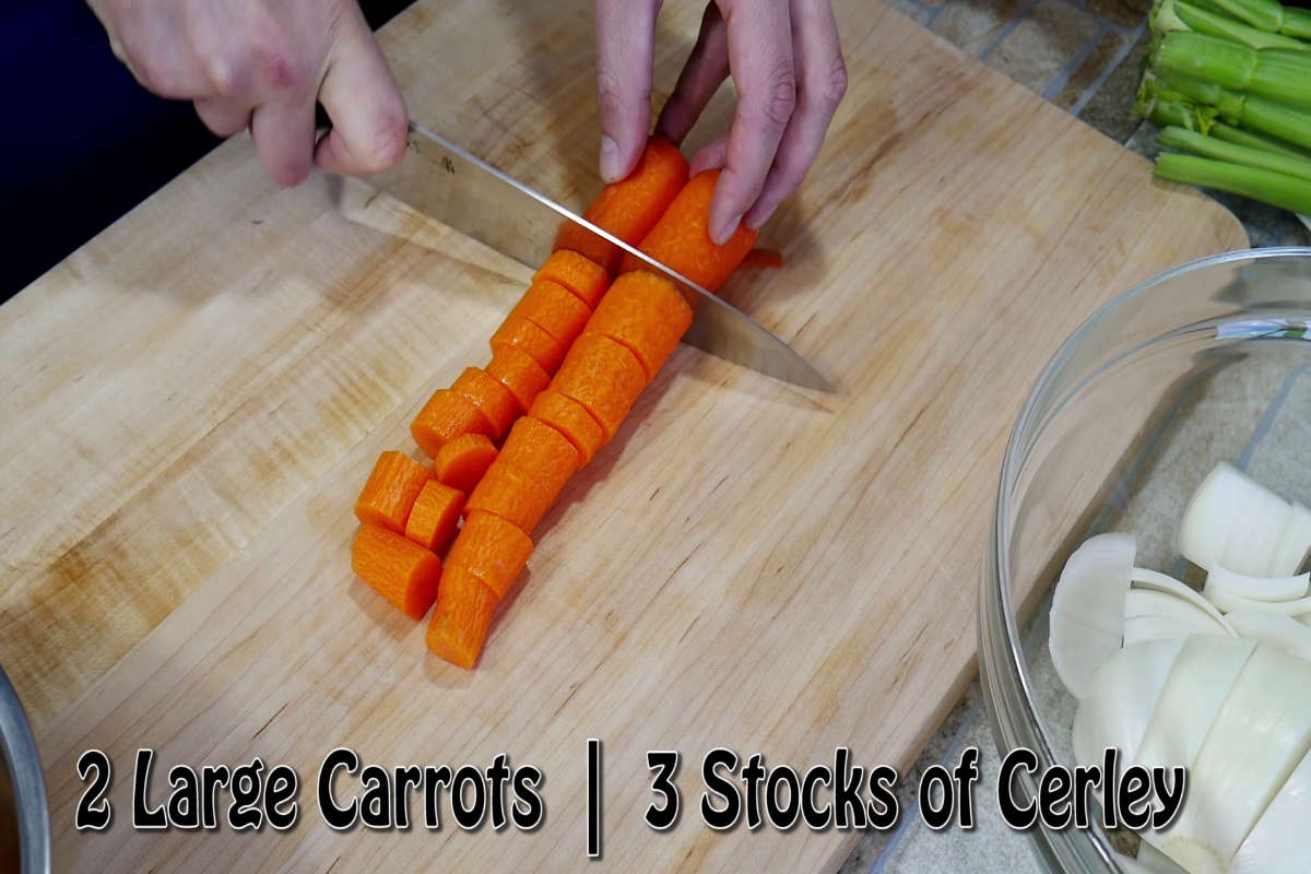 Preparing the Mirepoix starting with two large carrots.
