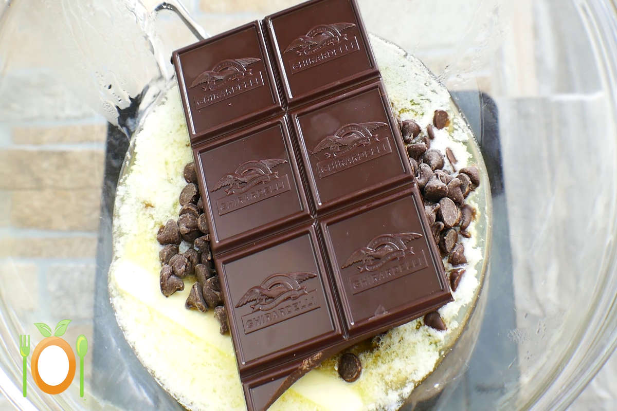 Chocolate and one stick of butter being melted together. 