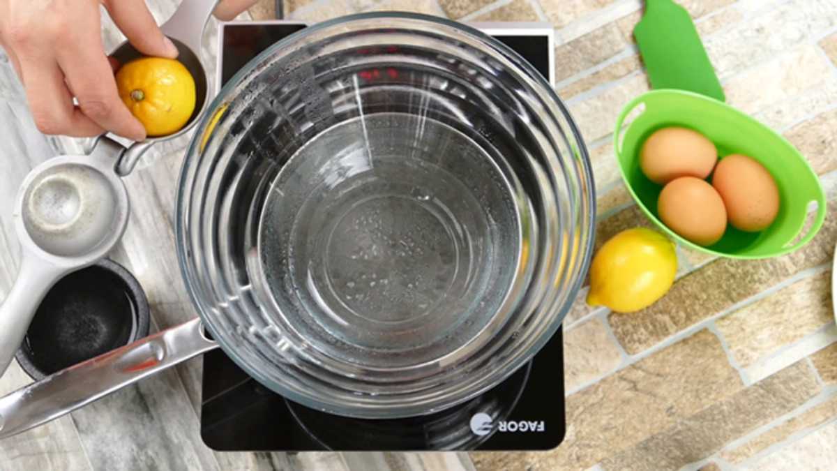Double boiler a glass bowl over boiling water.