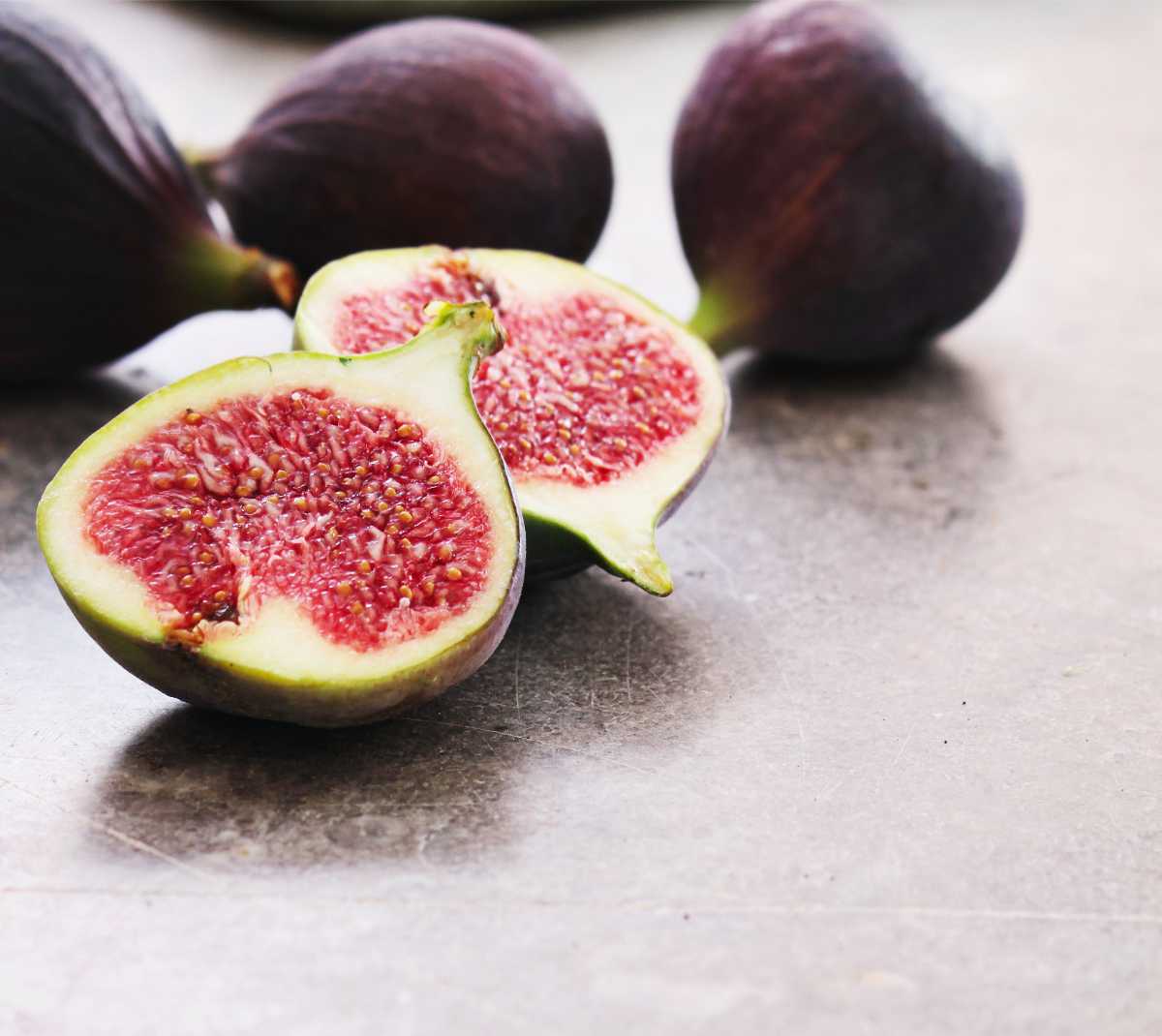 Fresh Figs sliced in half showing the beautiful red interior.