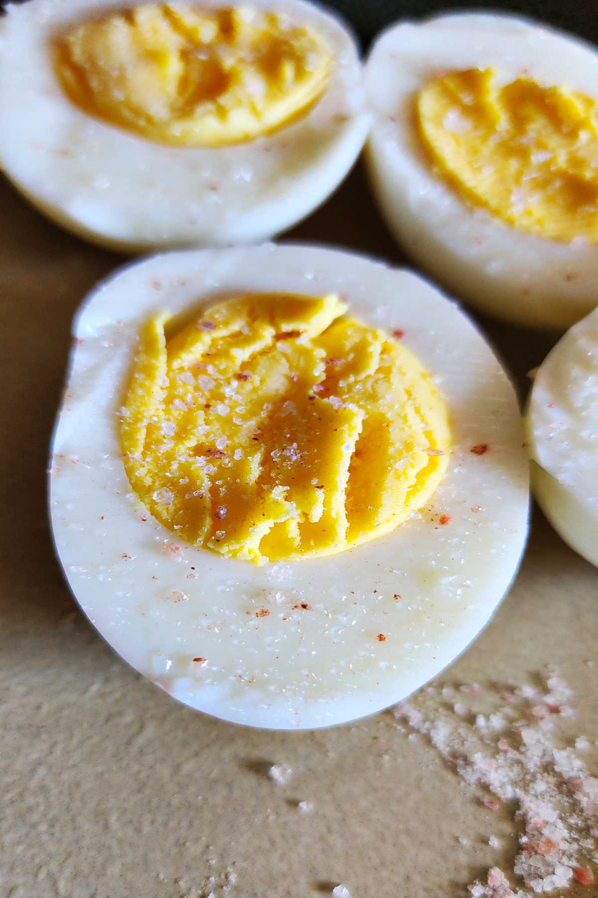 Hard boiled eggs cut in half with perfectly cooked yolks.
